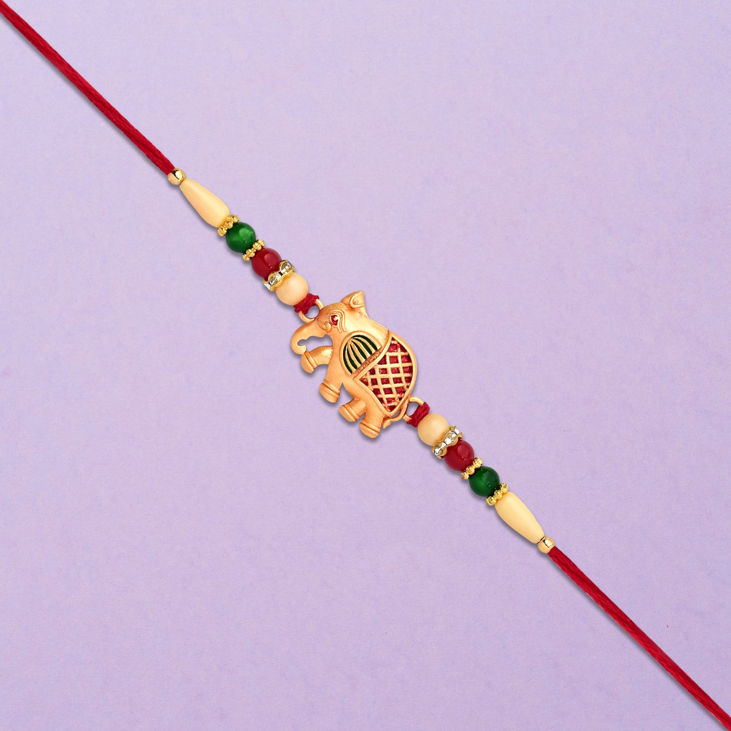 Golden Elephant Rakhi With Red Green Moti