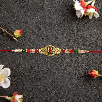 Religious Ganesha Rakhi In Gold Finish