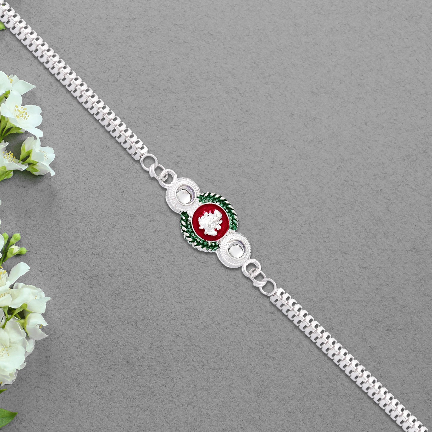 Shiny Silver Rakhi With Ganesha Emblem And Elegant Dual Chain Design