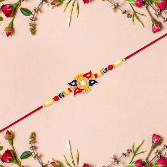 Designer Sun Motif Rakhi With Red And Blue Enamel Work