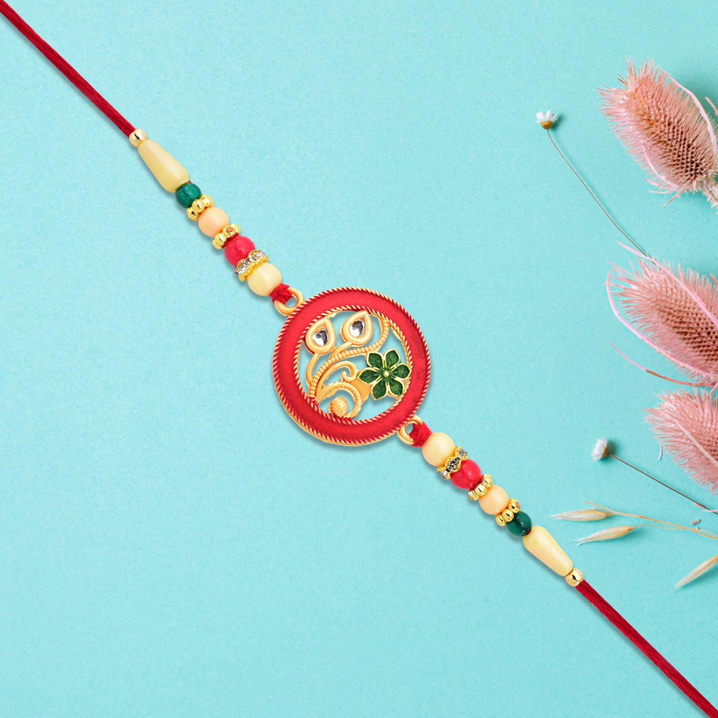 Round Designer Paisley Rakhi With Floral Charm