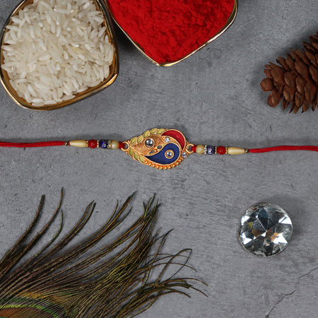 Elegant Rakhi With Enamel Paisley Design And Gold-tone Embellishments