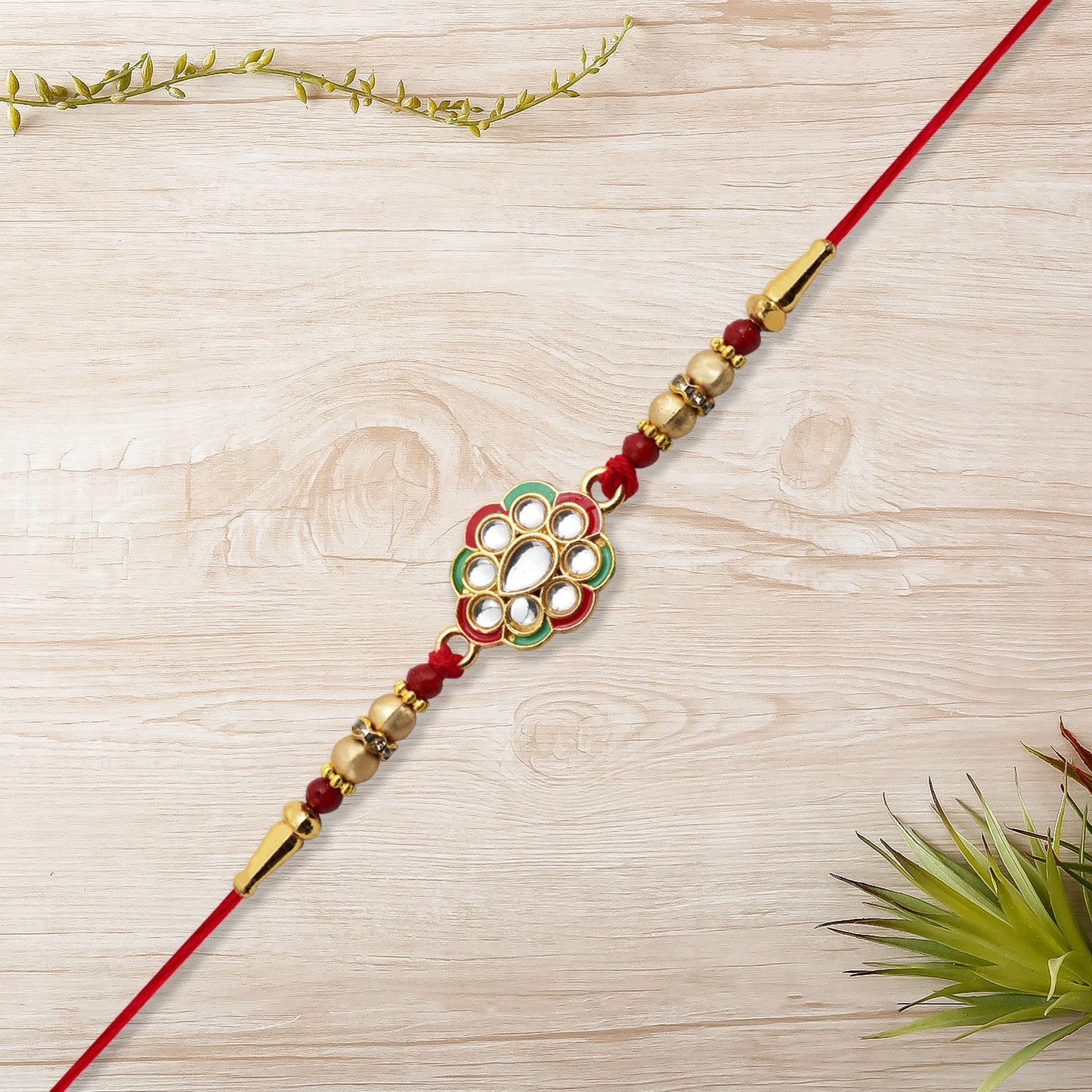 Kundan Work Floral Rakhi With Red Thread