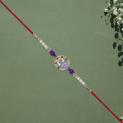 Elegant Ganesh Rakhi With Pearl And Purple Beads
